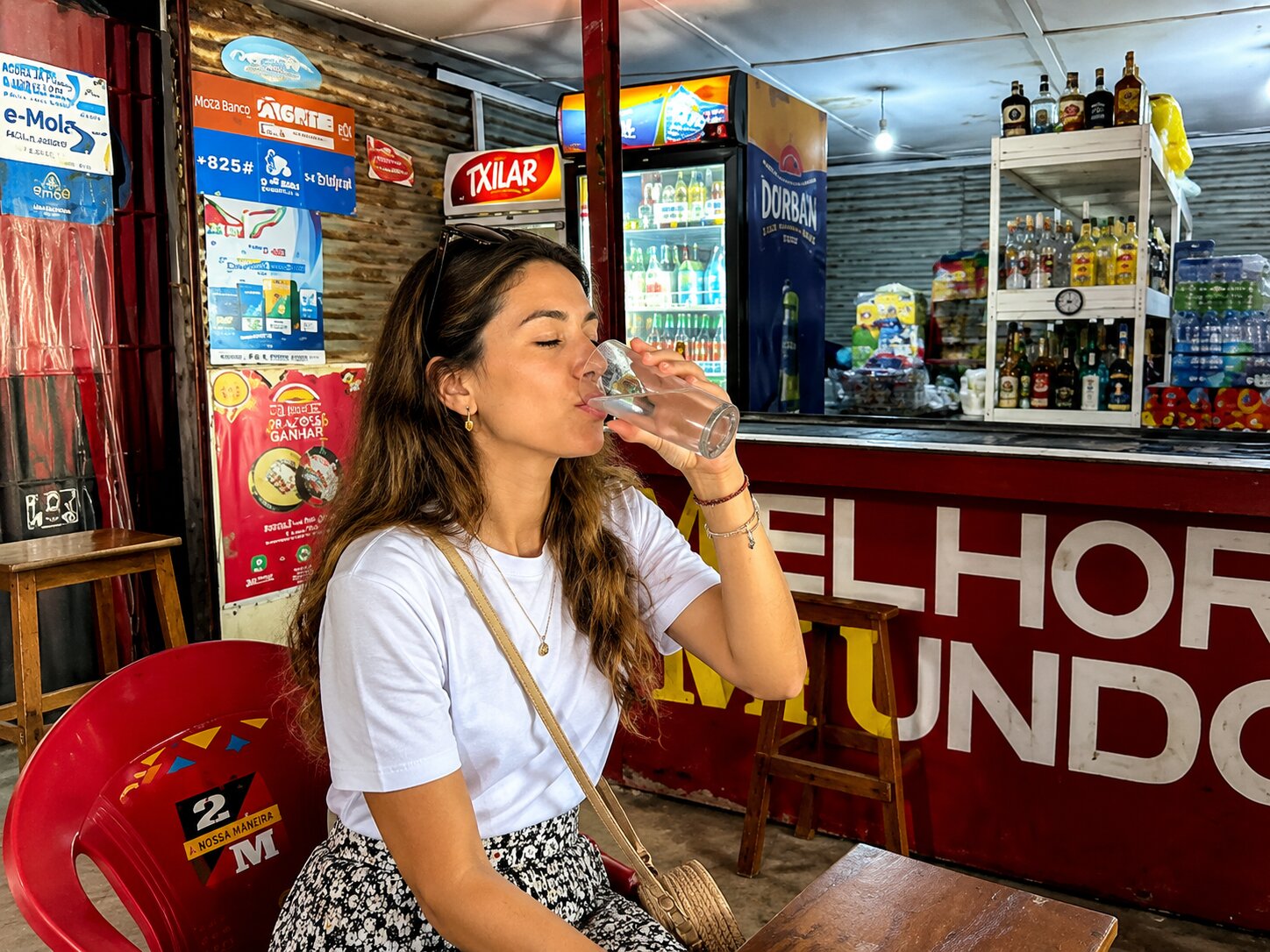 A Girl Drinking Water In Mozambique Hotel