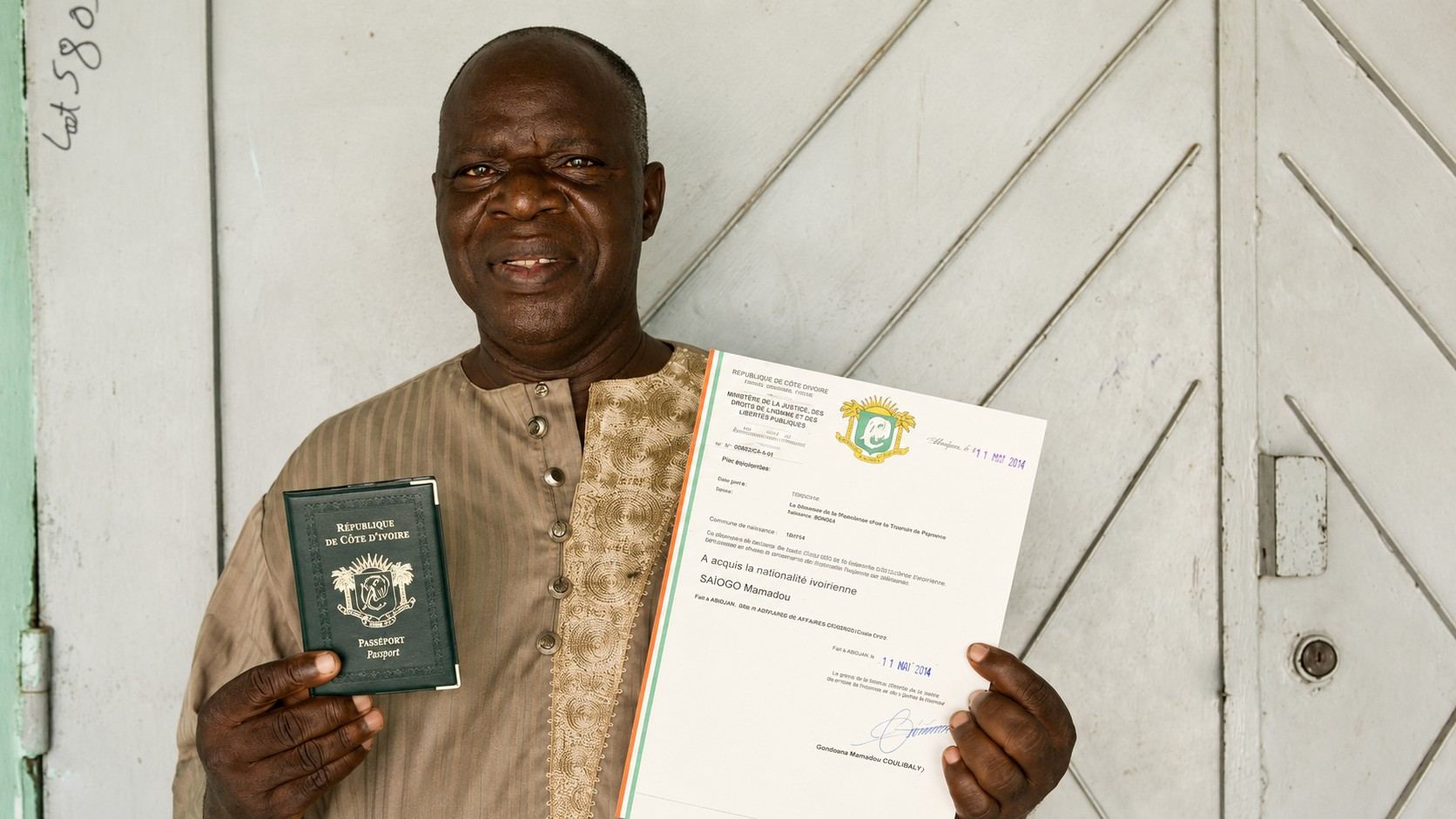 An Ivory Coast Citizen With His Passport And Papers