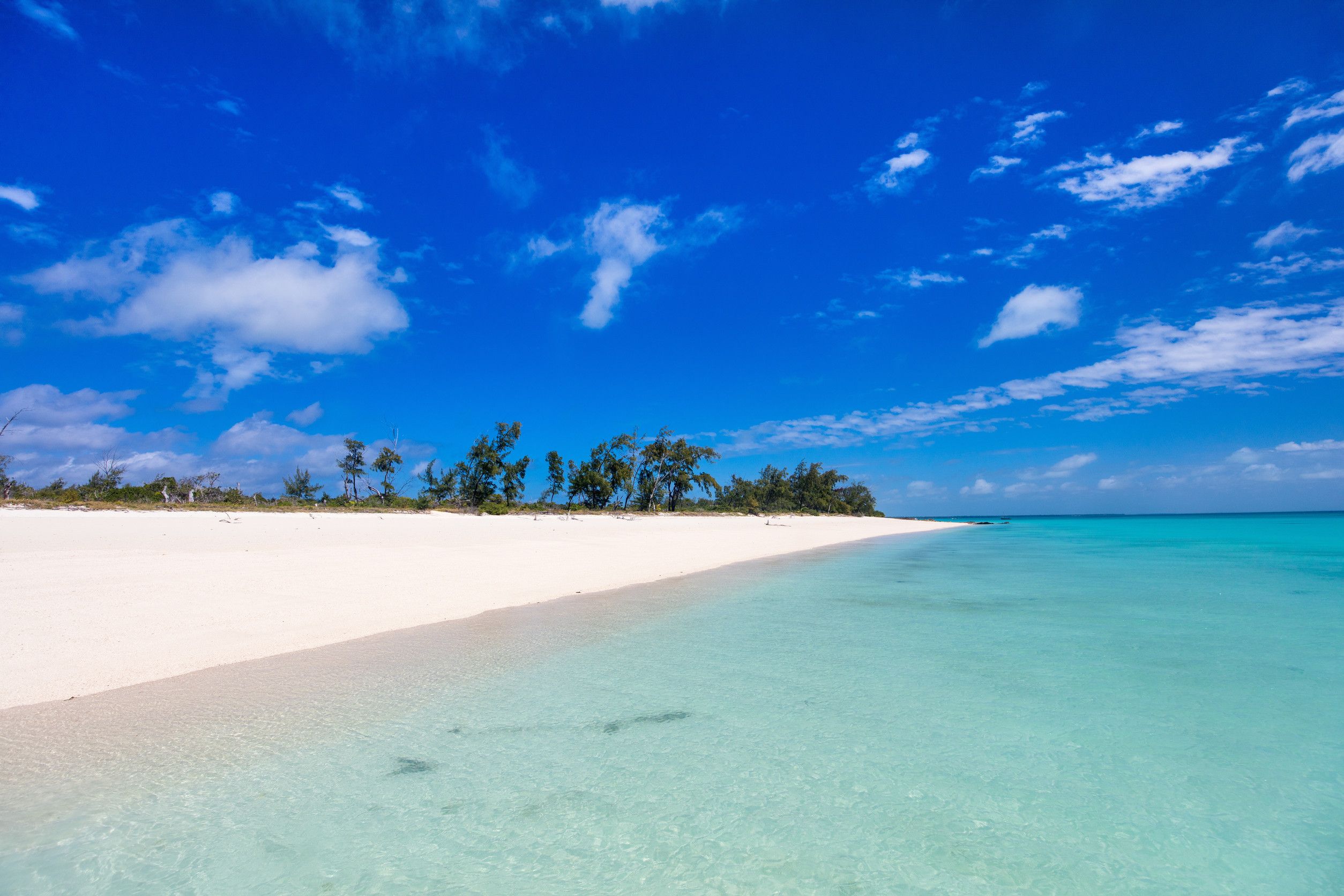 Beach With White Sand Turquoise Ocean Water And Blue Sky In Mozambique Africa