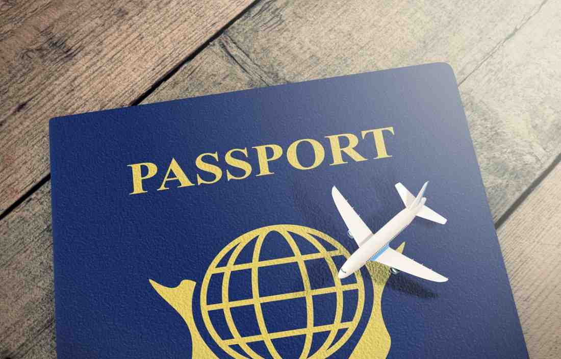 Closeup View Of A Passport With An Airplane
