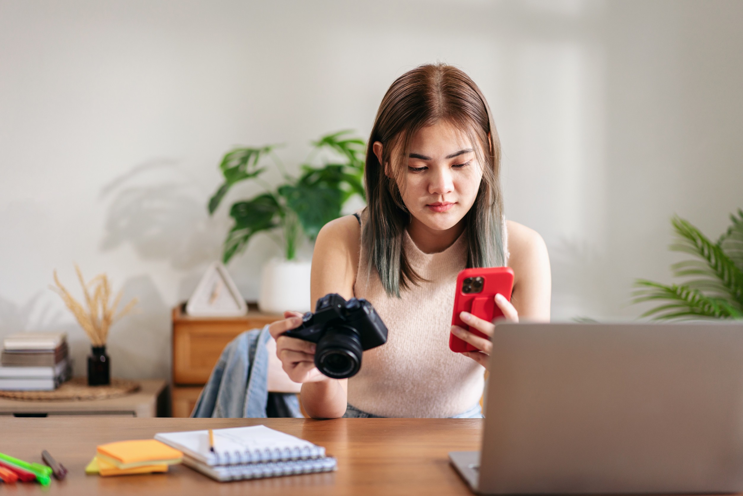 Female Fashion Artist Holding Camera And Smartphone