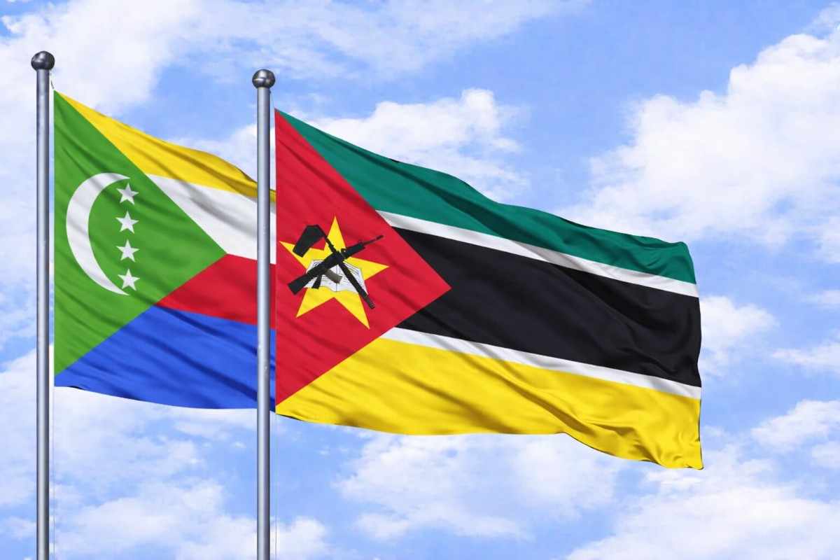 Flags Of Comoros And Mozambique In The Sky