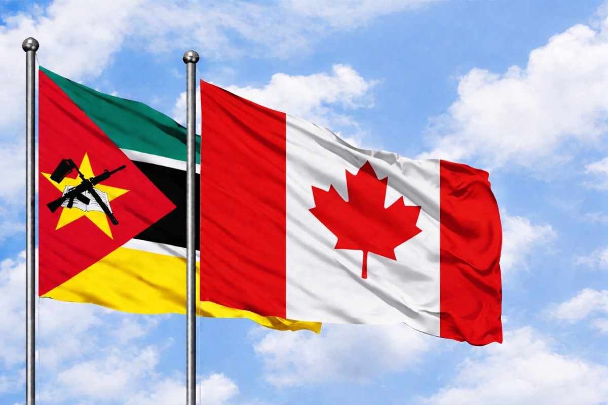 Flags Of Mozambique And Canada Flying High