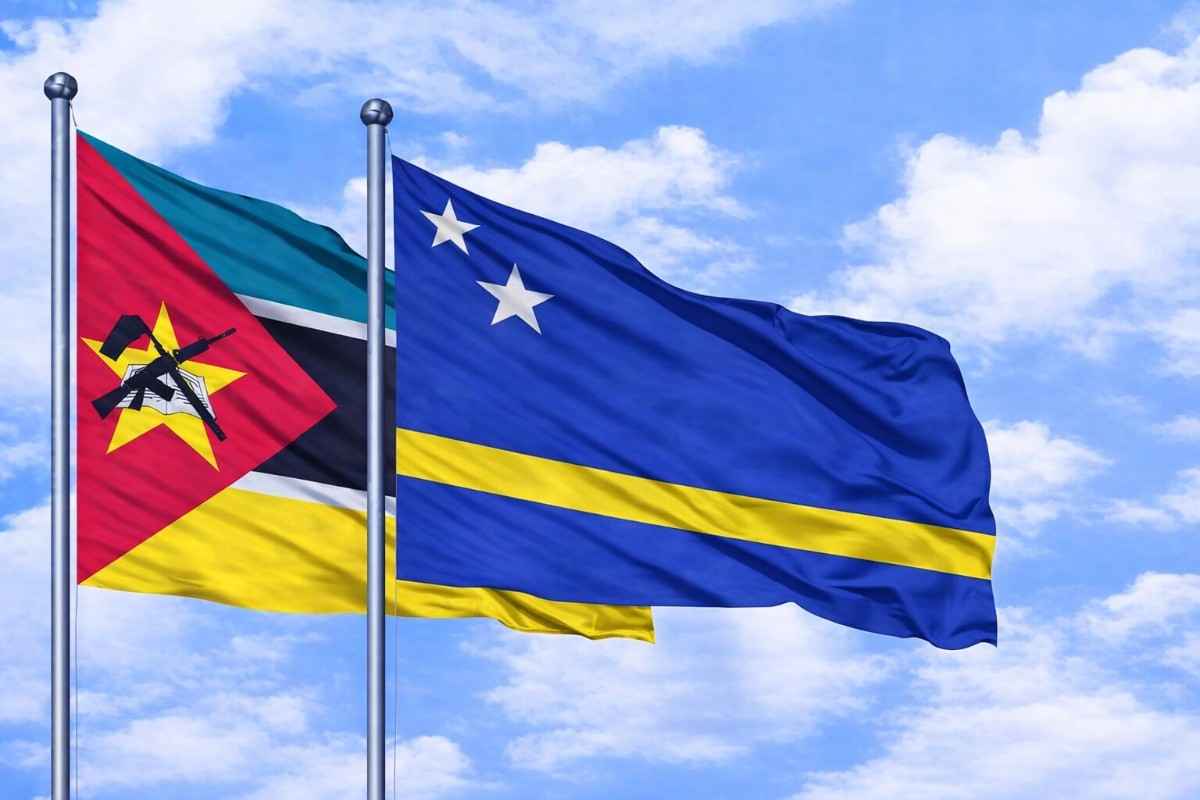 Flags Of Mozambique And Curacao In Breeze