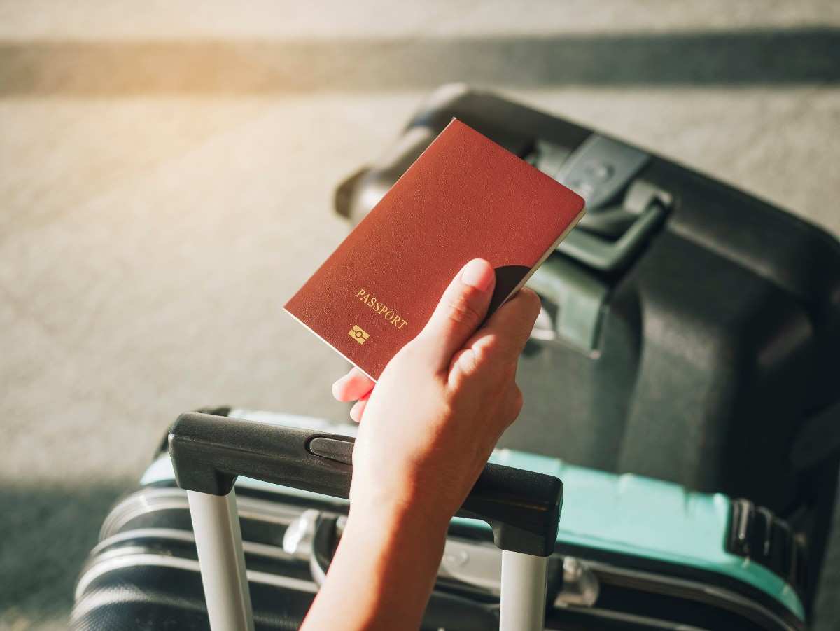 Hand Holding Passport