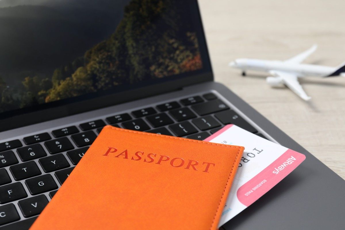 Passport And Laptop On Table