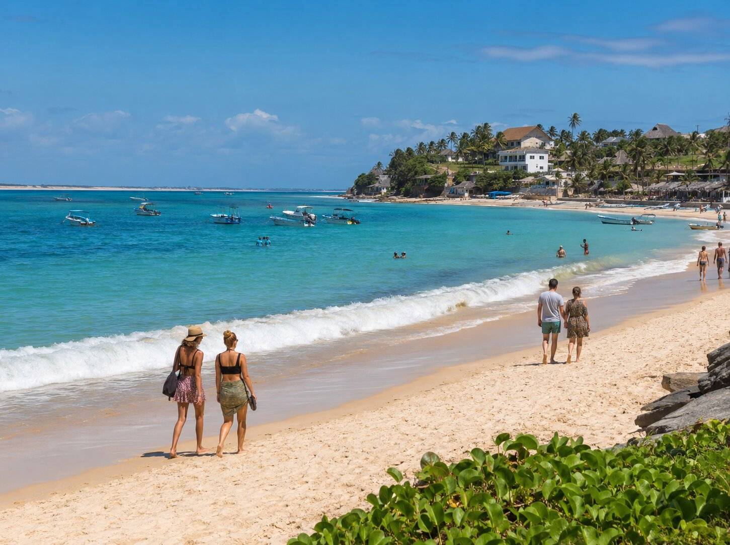 Tourists Walking Along Tofo Beach