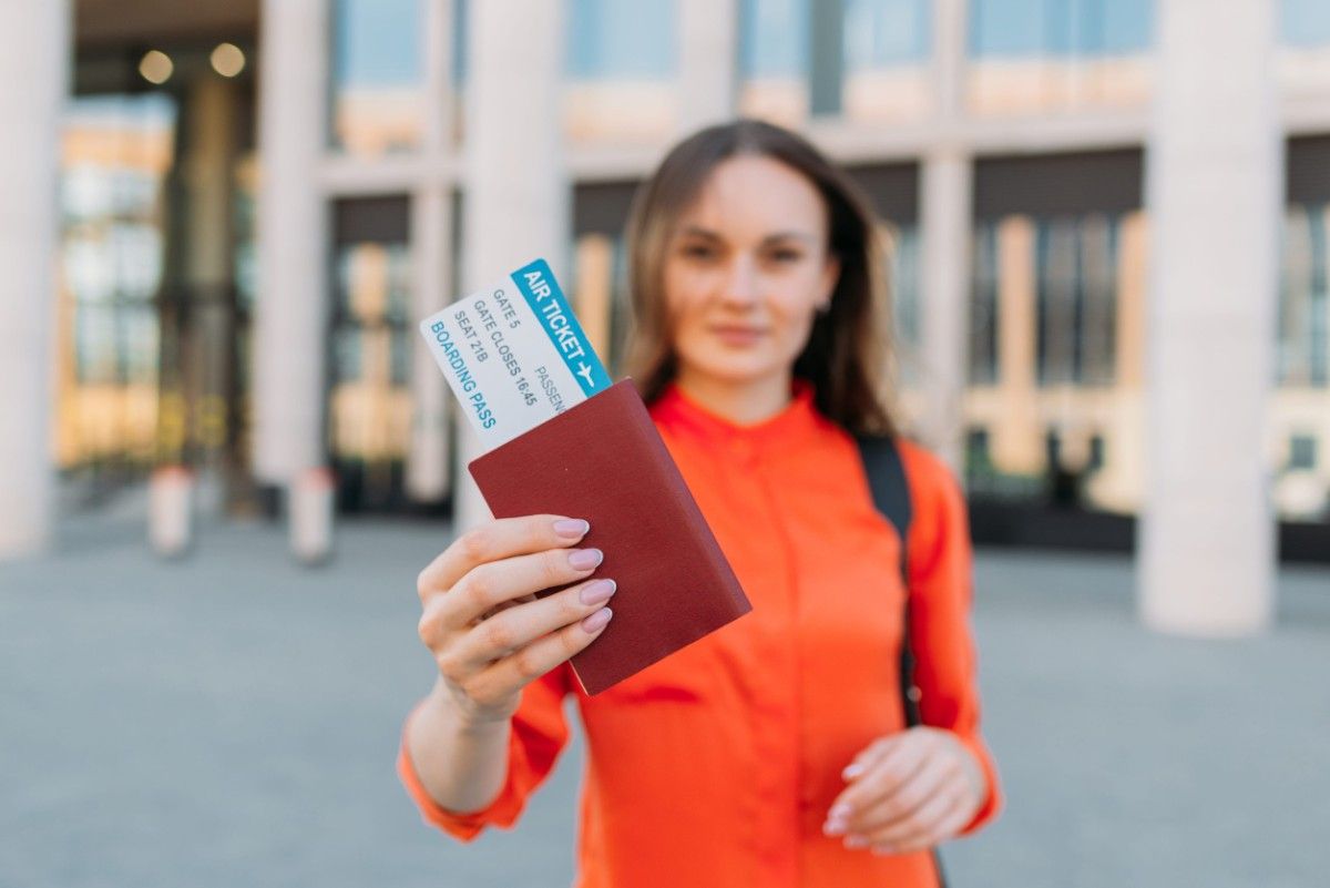 Woman Holding A Passport